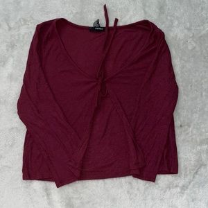 Burgundy opened tied shirt from the front
